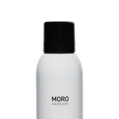 White hair care product bottle with black cap on a white background, featuring the brand 'MORO HAIRCARE'.